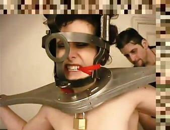 A master puts his slave in a variety of exotic torture devices
