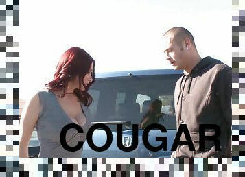 Wild cougar with long red hair enjoying a hardcore missionary style fuck