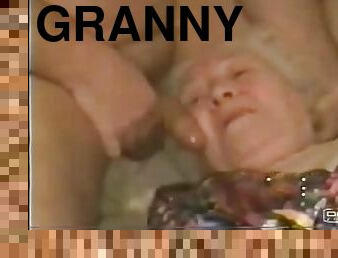 White-haired granny lets a guy rub his dick against her face