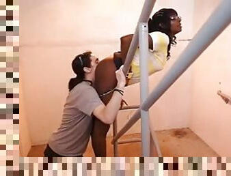 Ebony bitch wearing glasses gets her cunt licked on the stairs