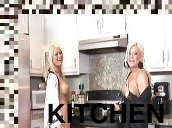 Two sizzling blondes toy their pussies and ride a dick in a kitchen
