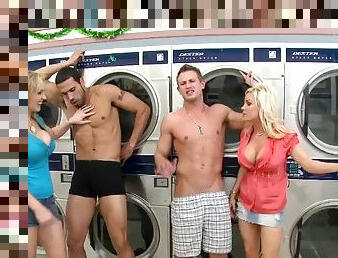 Two hot blondes have a foursome CFNM sex in a laundry