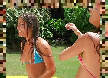 Two horny Latinas in bikini gets banged outdoors