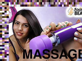 Teen brunette gives herself a foot massage using a sex toy