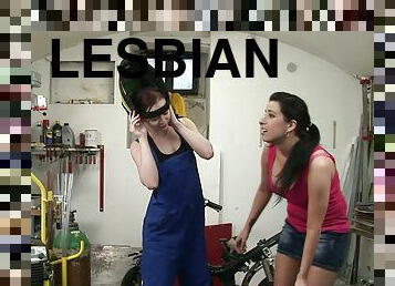 Horny babes have a lesbian moment in a garage