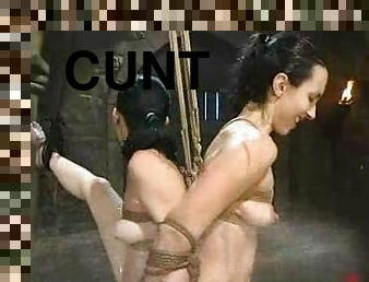 Wenona enjoys getting her cunt toyed and showered in BDSM scene