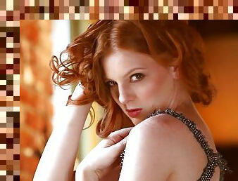 Shaun Tia the redhead model poses naked by the window