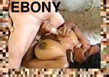 Bosomy ebony bitch takes a ride on a white cock in retro clip