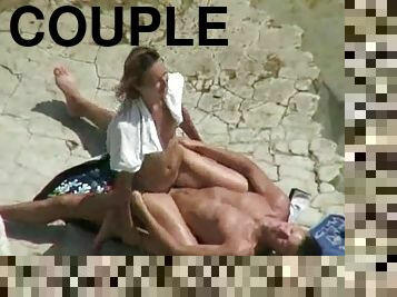 Horny couple banging on a beach caught on a voyeur's cam