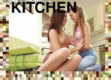 Two lovely babes are having a hot oral sex in the kitchen