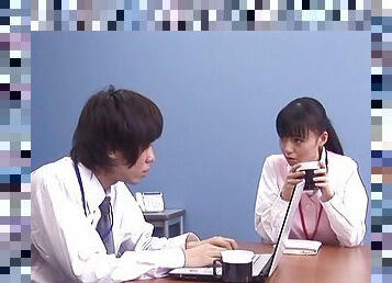 Raven haired Japanese babe delivers a steamy handjob in this office scene