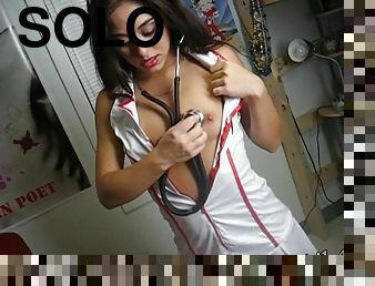Hot babe putting on a nurse costume and showing her tits