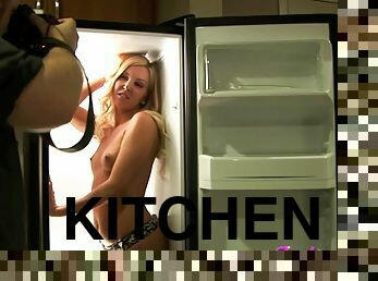 Horny blonde pornstar in the kitchen modelling in a thong