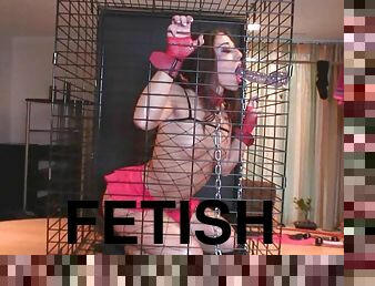 His sexy leashed slave is in a cage where she belongs