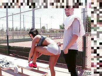 An athletic girl meets a dude in a park and fucks him in a public bathroom