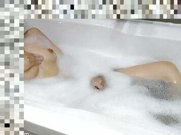 Petite asian girl Jayinne masturbates in foamy bathtub
