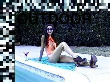 Slim Rebecca Lord fingers her ass and pussy by the pool