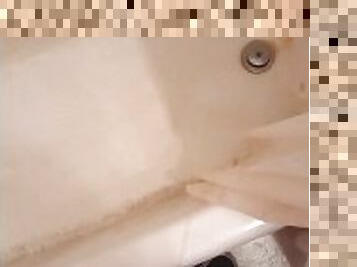 Pissing in my shower in my upstairs bathroom and fondling my dick and balls)