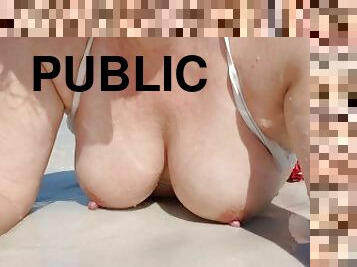 Public beach boob tease