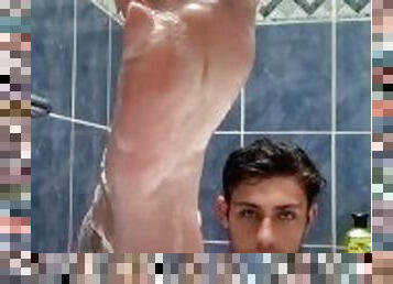 Boy baths & washes feet