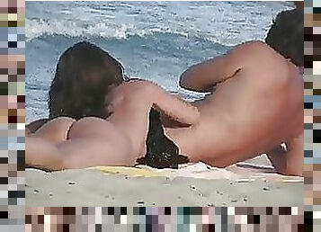 Sexy Voyeur Brunette With a Breathtaking Ass Sucks Cock On a Nude Beach