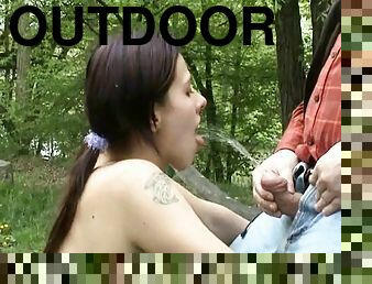 Brunette bitch lets her BF piss on her tits in outdoor fetish scene