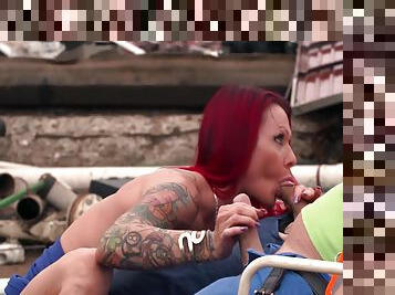 Redhead Milf With Big Silicone Tits And Tattoos Fucks Two Garbage Men In Junk