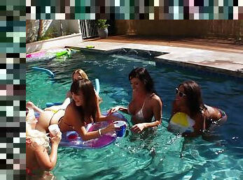 Lesbians in bikini enjoy licking and fucking using a strap on in an outdoors scene