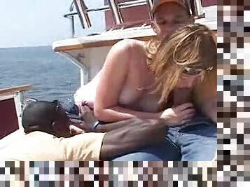 Interracial big cock sex on the boat for her