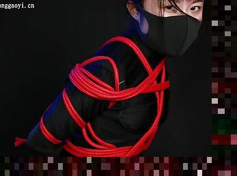 Ninja Girl Tied In Red Ropes