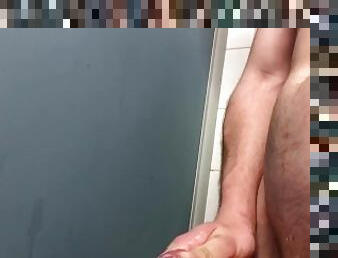 Huge cumshot in public shower cubicle!