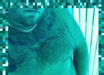 Hairy tattooed daddy with big cock cums on the sunbeds
