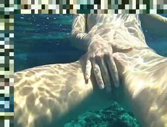 A Russian girl with a stunning body swims naked on a public beach. Tourists are thrilled!