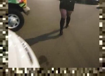 woman mastrubates and pissing in public parking at a fair