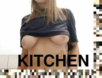 Teen girl shows her body in the kitchen