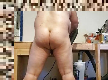 Slave sands down his workbench