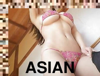 Big Asian titties are tempting in a skimpy bikini