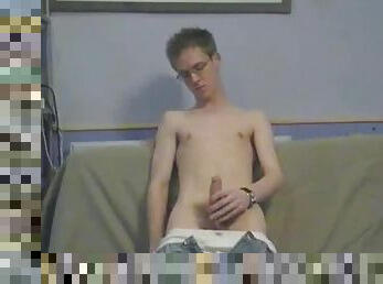 Cute twink in a slow striptease before jerking