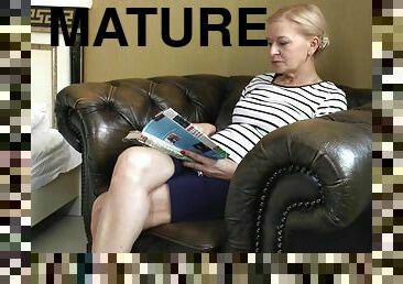 Old babe puts aside her magazine and masturbates tenderly