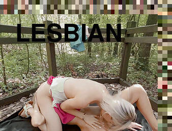 Lesbian sex in the forest from beauties Candee Licious and Emily Bellex