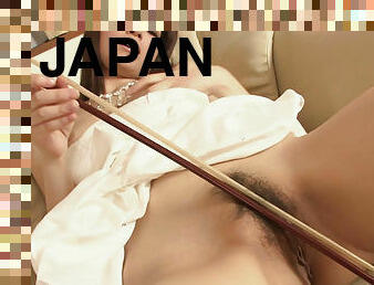 Japanese Yuria Tominaga masturbates with a bow