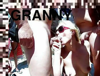 Blonde granny blowjobs tons of big dicks at the beach