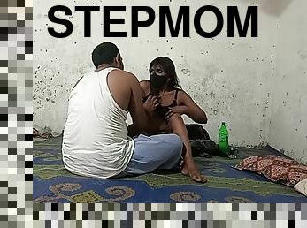 Stepmom and stepson share a bed in a hotel room