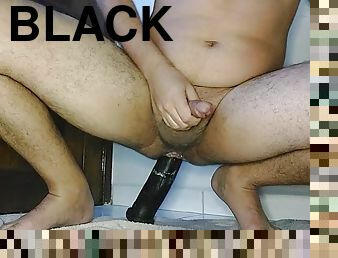 Long black dildo with cum on prostate