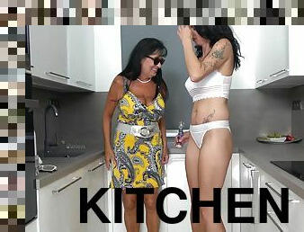 Hot brunettes playing with their wet pussies in the kitchen