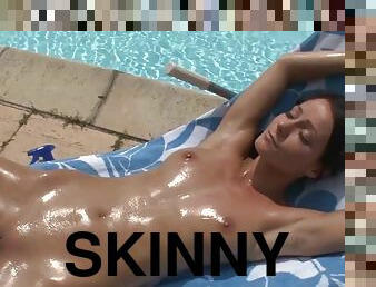 Young skinny babe with perky tits oiled up and masturbating outdoors by the pool - Melissa