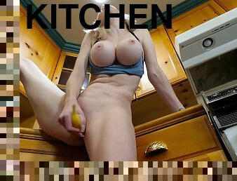 Blonde solo chick Katie Monroe pleasures her pussy in the kitchen