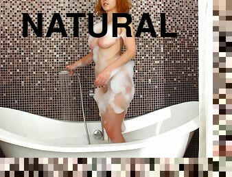 Naughty redhead Eva Blade enjoys pleasuring her pussy in the bathroom