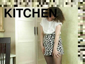 Chubby curly teen masturbates in the kitchen