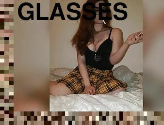 Cute redhead teen in glasses smoking